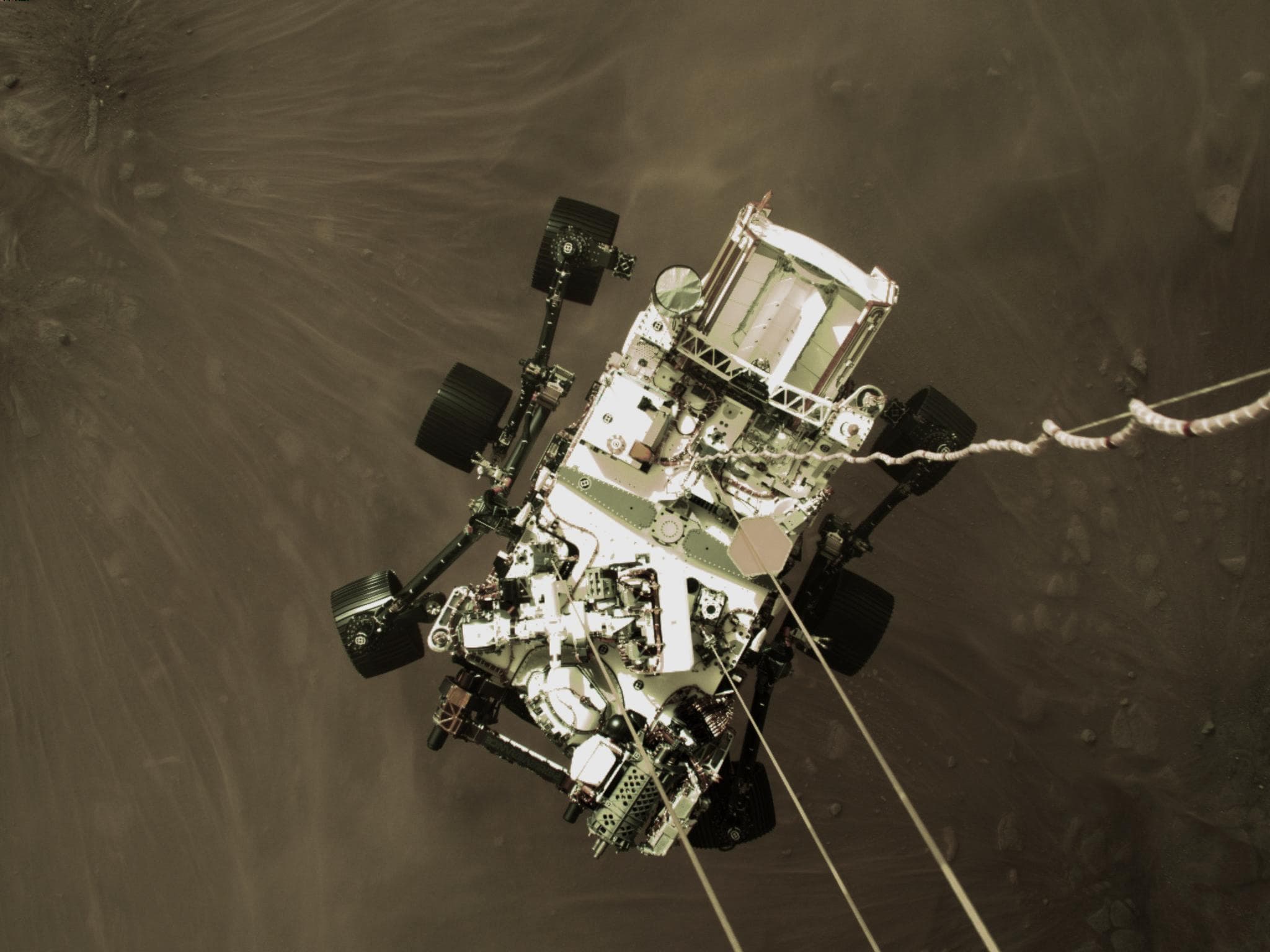 NASA Perseverance rover descending toward the surface of Mars.